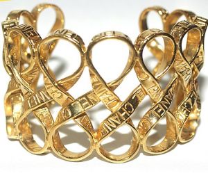 Chanel Gold Toned Ribbon Weave Cuff Bracelet.jpg